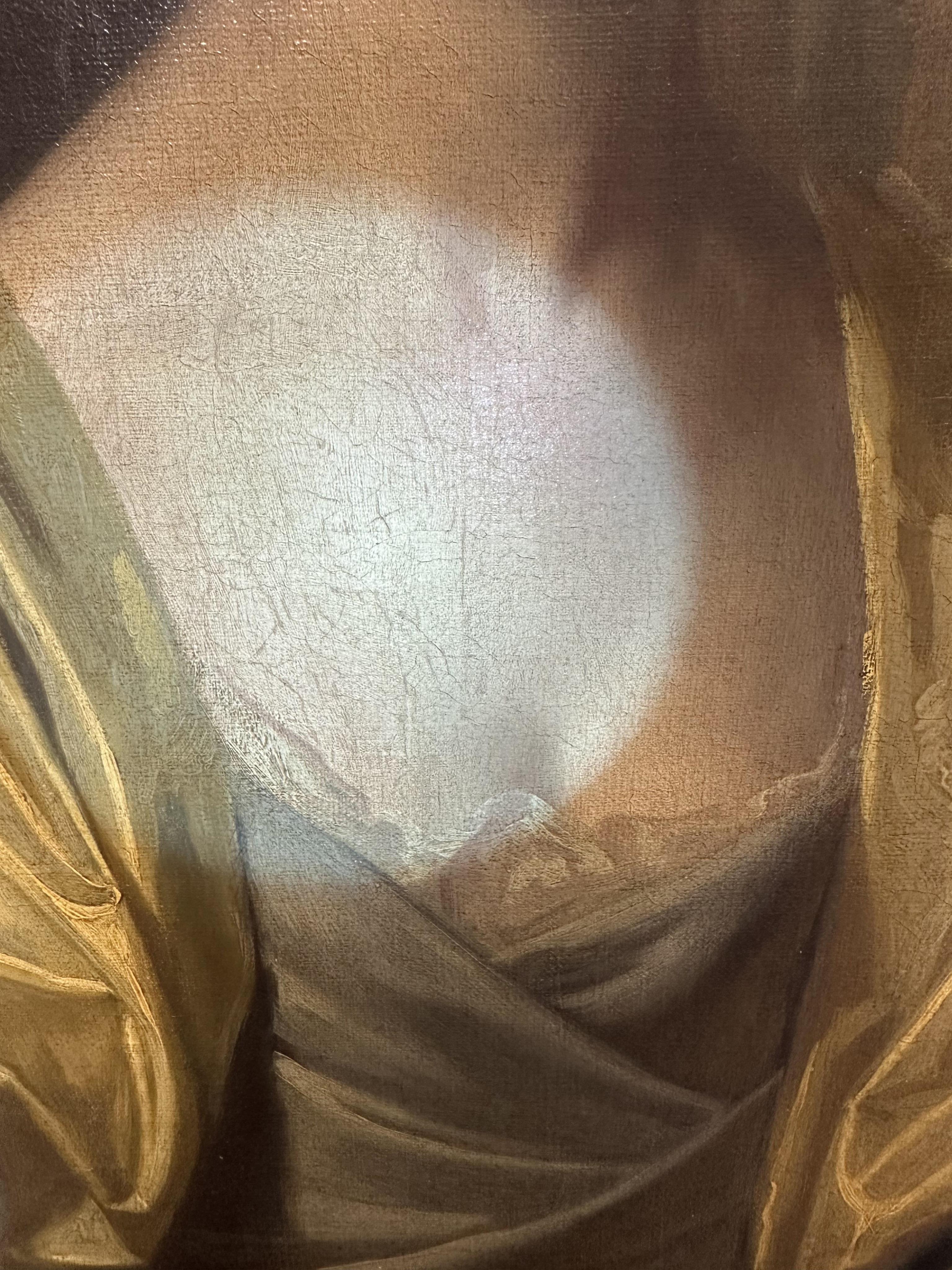 Follower of George Romney, British 1734-1802, A portrait of a young lady with yellow drapery